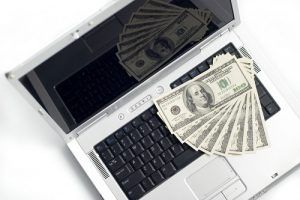 money on a laptop